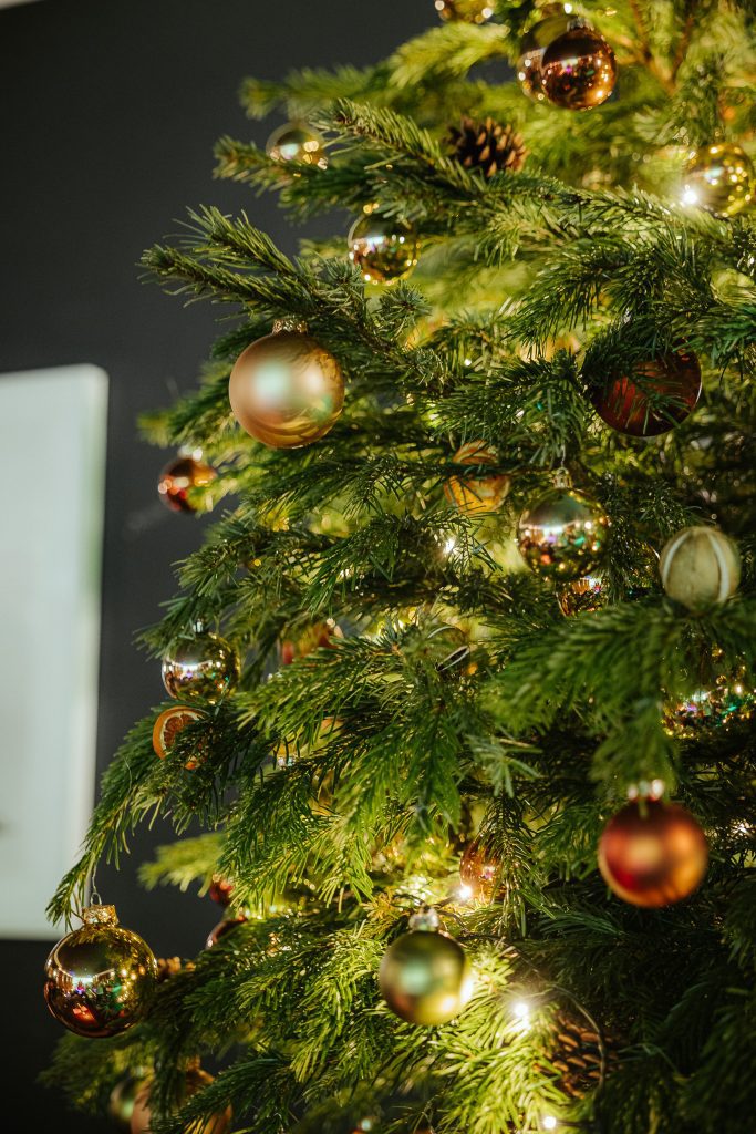 A beautifully decorated Christmas tree decorated by Amazing Grace London